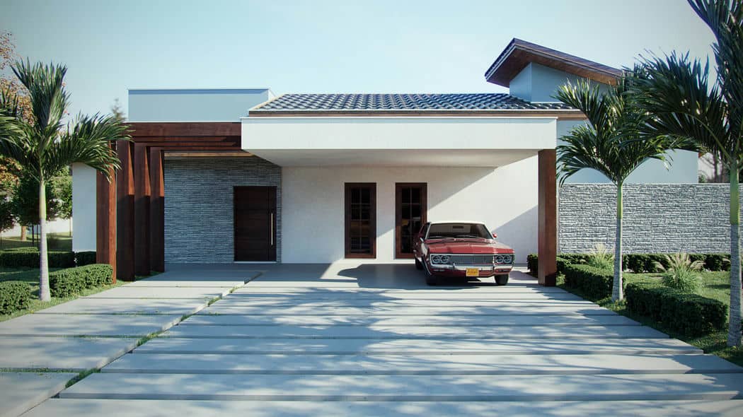 Uma casa com carport estendido, sob o qual há um carro vermelho estacionado, e a estrutura também apresenta paredes brancas com detalhes em pedra.